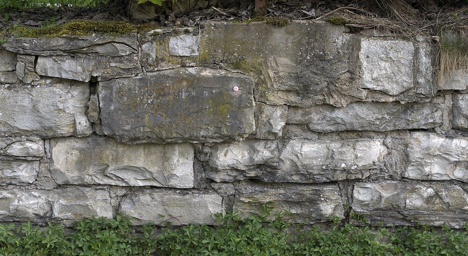 An old retaining wall made of stone