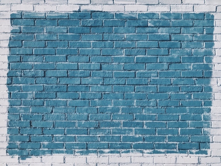 blue paint on a concrete wall. 