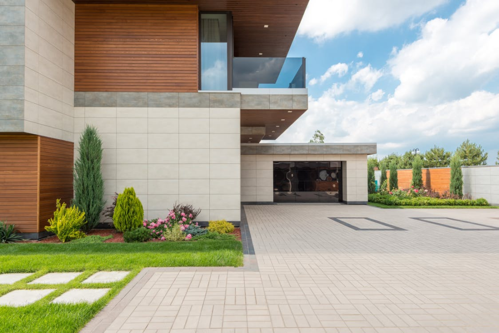 A house with a paver driveway
