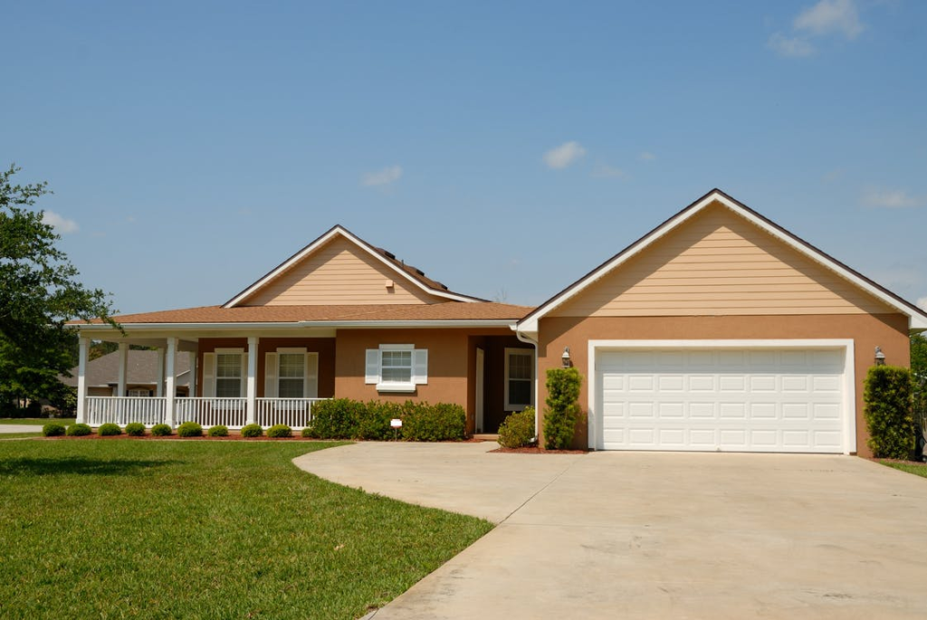A new house with a new garage door and a spacious driveway   