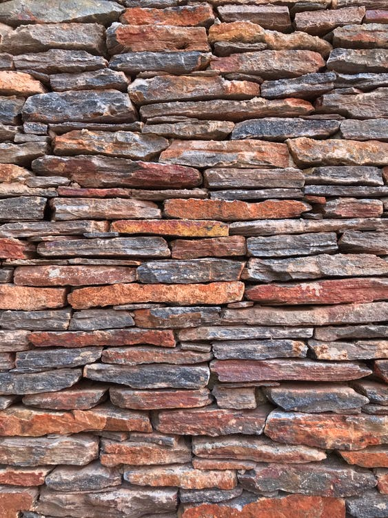 A wall with stone cladding.