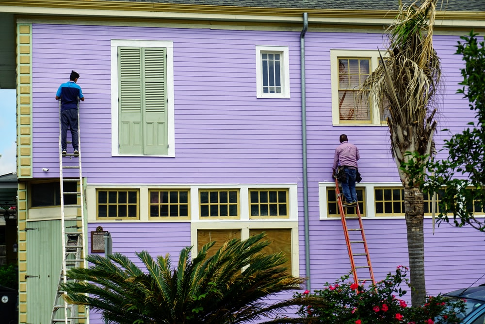 People painting a home