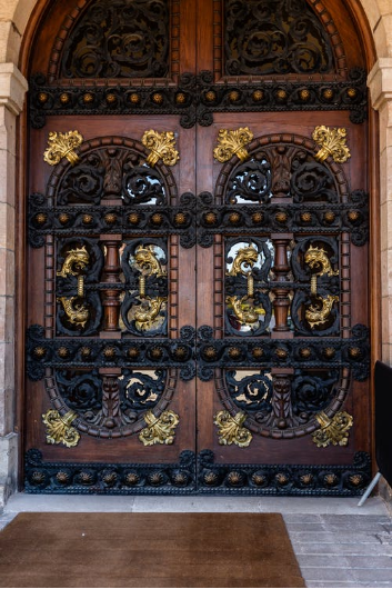 Wooden doors with golden hardware.