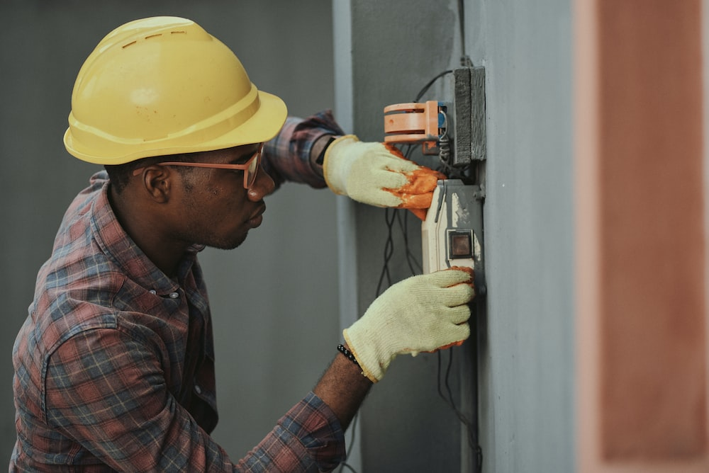 a man checking an electricity meter